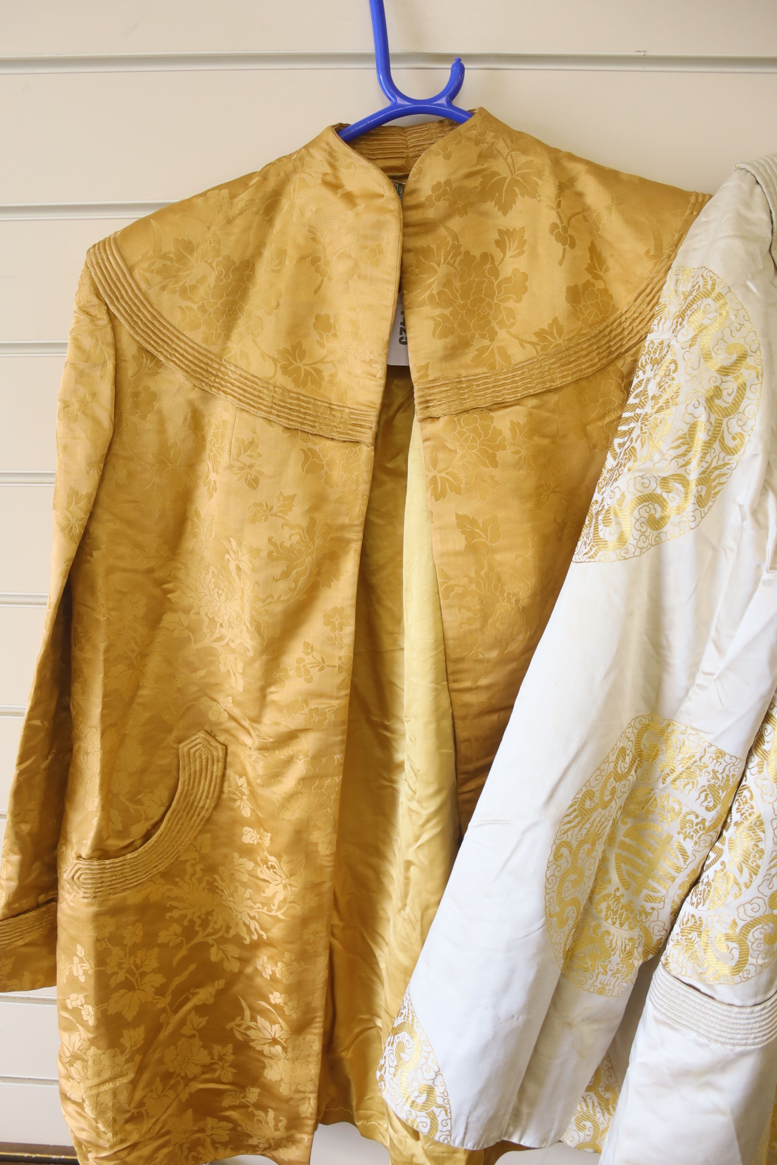 A 1940's Chinese yellow damask jacket, length 87cm, and a similar brocade jacket